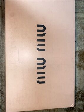 Miu women’s Miu Matelasse’ leather logo slides